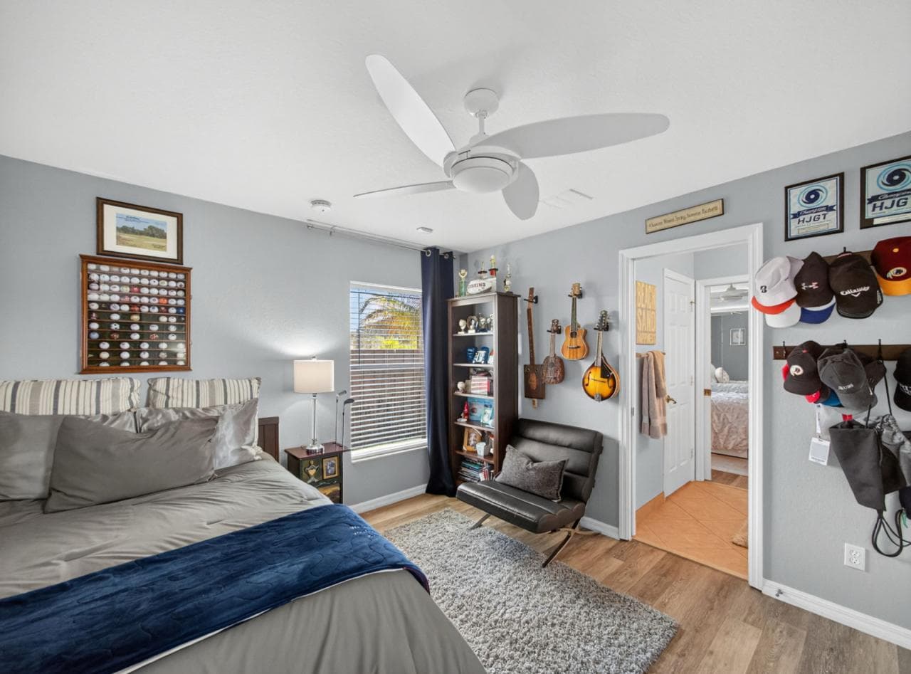 Bedroom with guitars and sports memorabilia