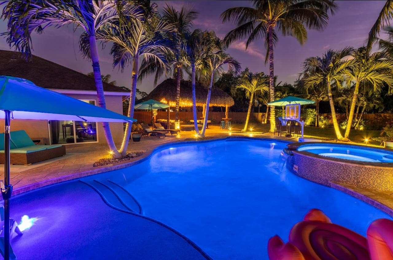 Pool and tiki at night